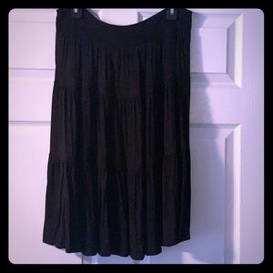 Black skirt. “Tierd” pattern